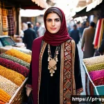 Home 21 시리아 여성들의 패션 트렌드 - A dignified Syrian woman standing in a bustling Damascus street market, wearing a richly embroidered...